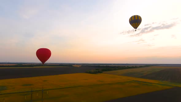 Couple Air Balloons Flying Over Fields and Electric Cables, Country Development