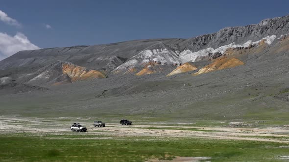 View of Safari Vehicle Driving on Sand Tracks Road, Aerial Over Off Road 4X4 Car Driving Along