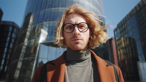 Portrait of Young Handsome Businessman in Downtown