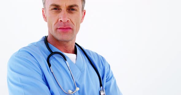 Portrait of male doctor standing with arms crossed