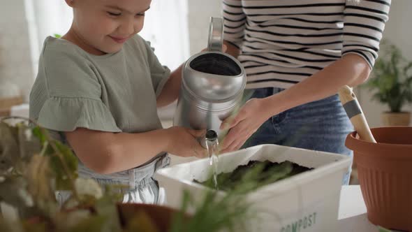 Video of mother and daughter finishing home compost.  Shot with RED helium camera in 8K