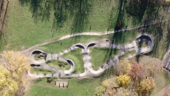 Top-down aerial view of a pumptrack in a park