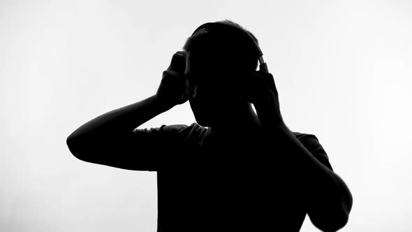 Music Fan Listening to New Song in Big Headphones on White Background, Hobby