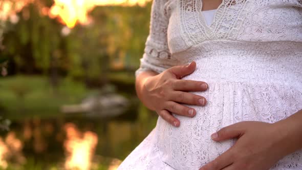 Pregnant Woman Feeling Happy at Garden Home