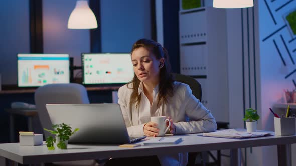 Manager Speaking Online with Remotely Coworkers Late at Night