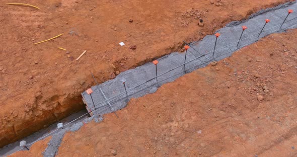 Construction of Strip Foundation Reinforcement Frame on Reinforced Concrete Structure of House