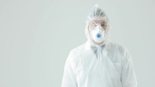 Man in Protective Suit, Mask and Glasses Coughing, Coronavirus Pandemic Threat.