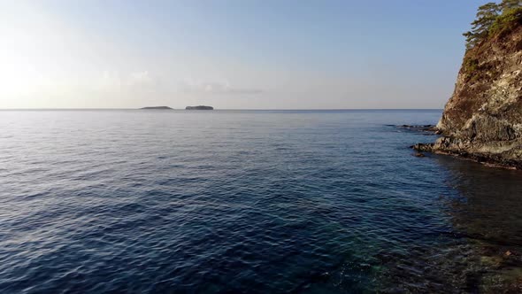 Seaside Rock And Waves Sunrise