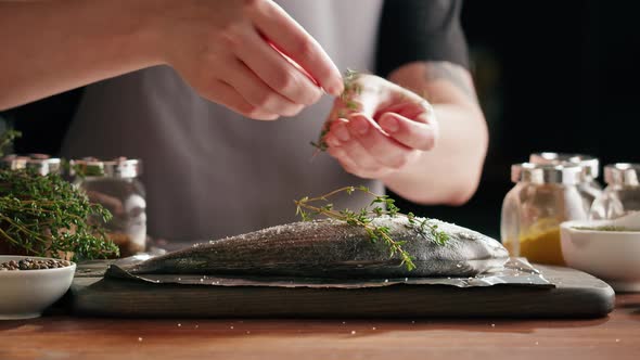 Woman Cooking Fish Closeup