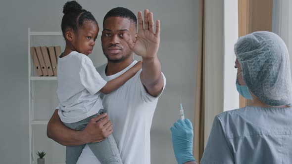 Young Serious Man Afro American Father Holds in Hands Little African Daughter Child Preschool Girl