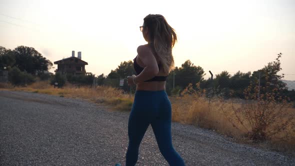 Follow to Young Girl Running at Country Road