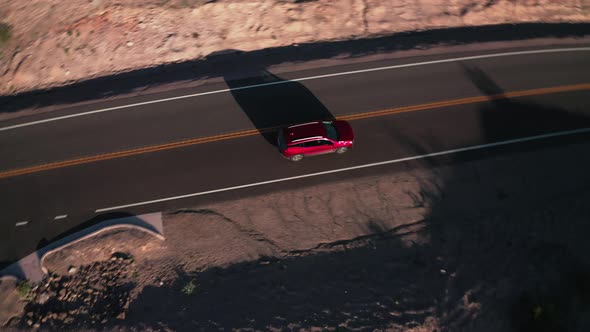 Red car driving on the road 