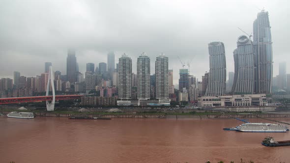 Brown Yangtze River Against Chongqing in China Timelapse