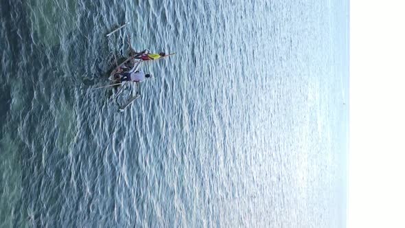 Tanzania Vertical Video  Boat Boats in the Ocean Near the Coast of Zanzibar Aerial View