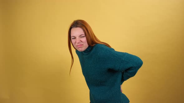 Young Red Hair Woman Posing Isolated on Yellow Color Background Studio