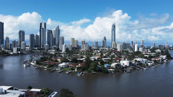 Unique aerial view of popular real estate canal property close to the towering Gold Coast Australia