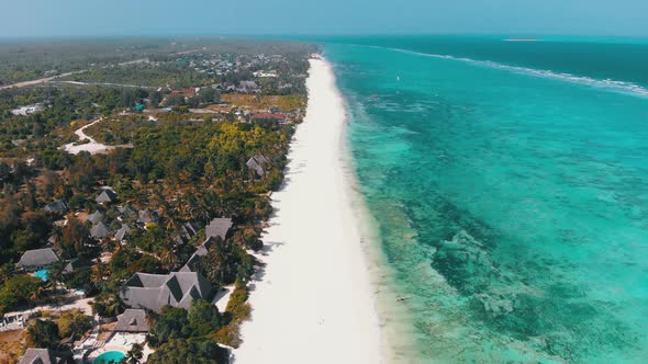 Ocean Coastline Barrier Reef By Beach Hotels at Low Tide Zanzibar Aerial View