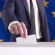 Voting. Man Putting a Ballot with European Union Flag on Background. - VideoHive Item for Sale
