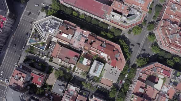 Time Lapse Aerial of Barcelona City Streets With Vehicles Amongst Buildings