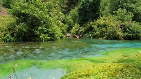 Beautiful Turquoise Spring Blue Eye or Syri i Kalter Near Muzine Town in Albania