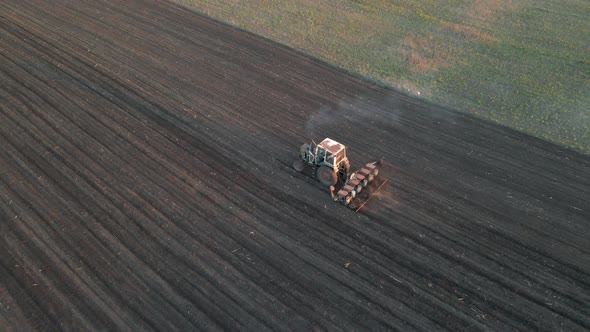 Aerial Shot of Agricultural Industry Tractors Machinery Tools Plow Large Areas Soil