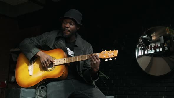 Young Afro-American Man Playing Romantic Music By Guitar.