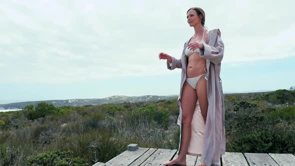 Woman standing on boardwalk