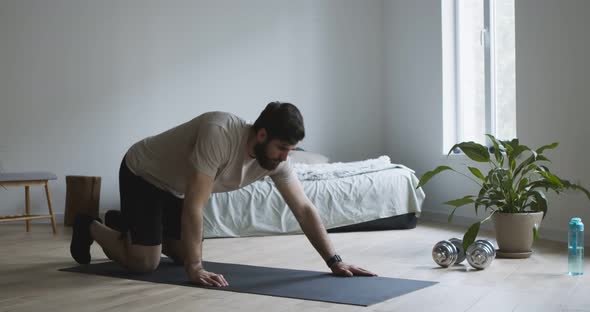 Bearded Guy Using Smartwatch Before Starting Doing Push Ups