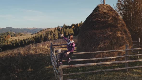 Woman with Mobile at Mountain Aerial