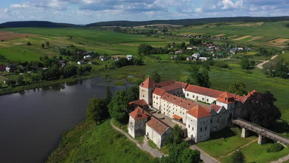 Svirzhskyi Castle in the Cloudy Summer Day Ukraine