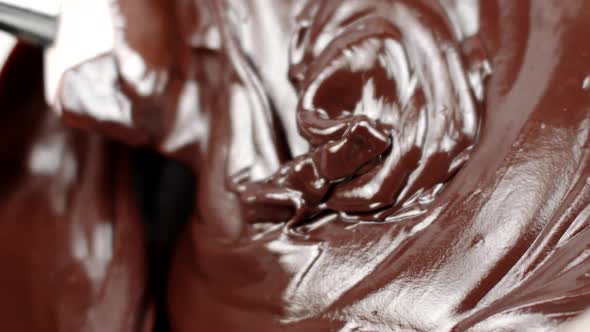 Spatula Mixes Thick Mass Melted Chocolate for Delicious Cakes Close Up Slow Mo