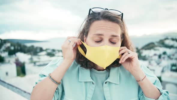 A Young Woman in Glasses Recording Video for Vlog in Social Media.