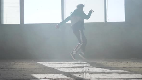 Skillful Young Rapper Dancing in an Abandoned Building