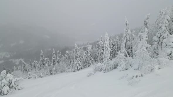 Snowstorm Aerial View of Mountains Winter Time