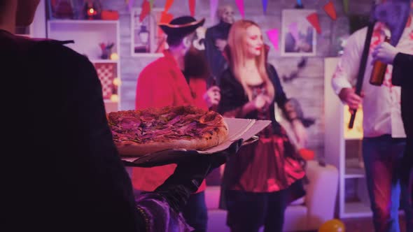 Follow Shot of Witch Girl Arriving with Pizza