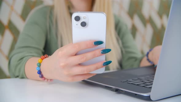 Girl browsing internet and social media news feed on smartphone in 4k video