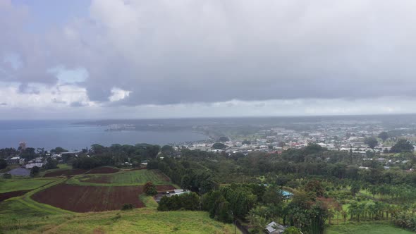 Aerial wide shot of downtown Hilo in the rain on the Big Island of Hawaii. 4K