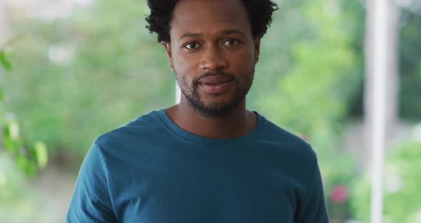 Portrait of biracial man looking at camera and smiling