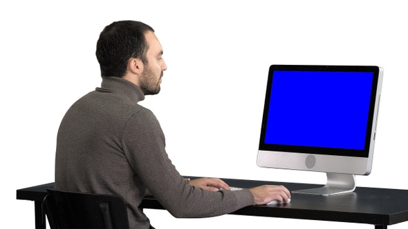 Businessman working with a computer white background