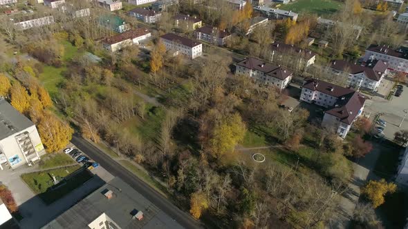 Aerial view of park next to three-story and five-story houses 55