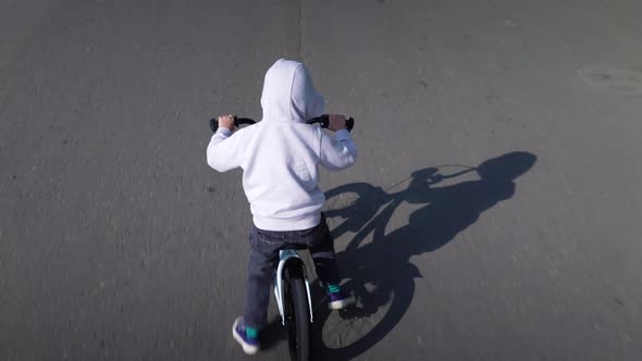 Cute 3 - 4 Years Boy Child Learning To Ride First Running Balance Bike.