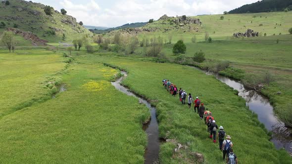 Group Of People Trekking In Meadow 2