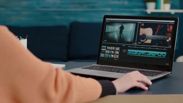 Multimedia Designer Using Software to Edit Video Footage