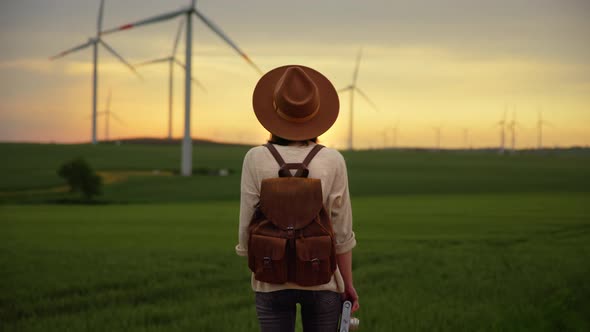 Young photographer with a retro camera looking at alternative energy generation