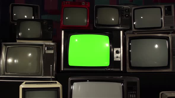 Vintage TV Set with Green Screen Between Many Retro TVs. Dolly In. 4K Version.