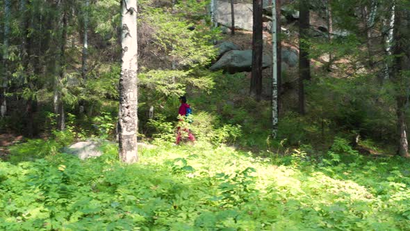 A Girl Walks in the Woods