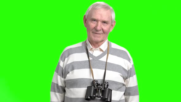 Happy Old Man with Binoculars Round His Neck
