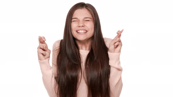 Portrait of Pretty Female Youngster Wearing Casual Shirt Being Tense Screwing Up Her Eyes Begging