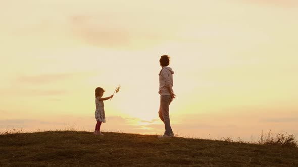 Image Of Mother And Daughter At Sunset.