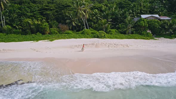 Young Woman Run on the Sand Paradise Anse Bazarca Beach